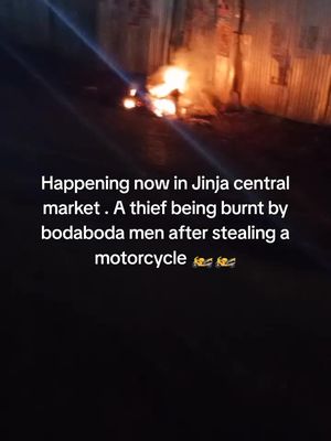 Happening now in Jinja central market. A thief being burnt by bodaboda men after stealing motorcycle